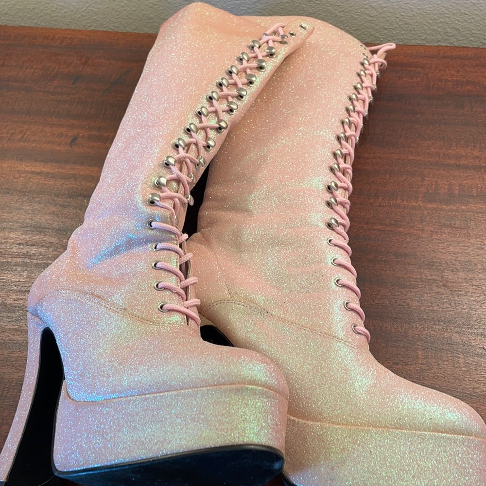 Iridescent pink Platform lace up boots.